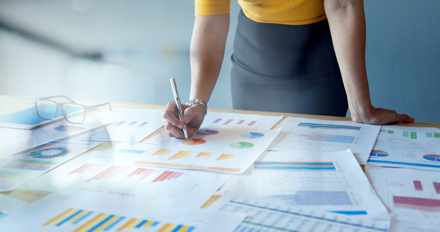 Woman reviewing charts and graphs