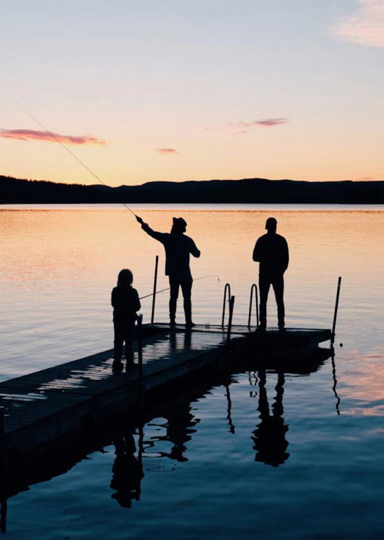 Friends fishing on a lake