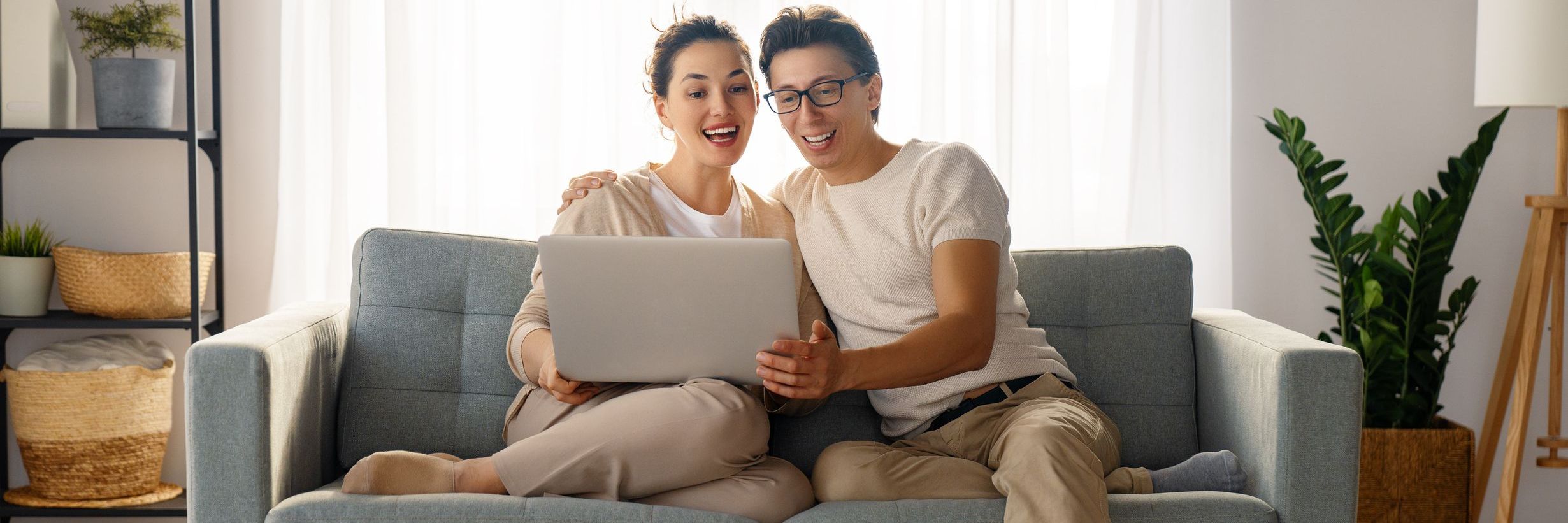 Couple on couch with laptop