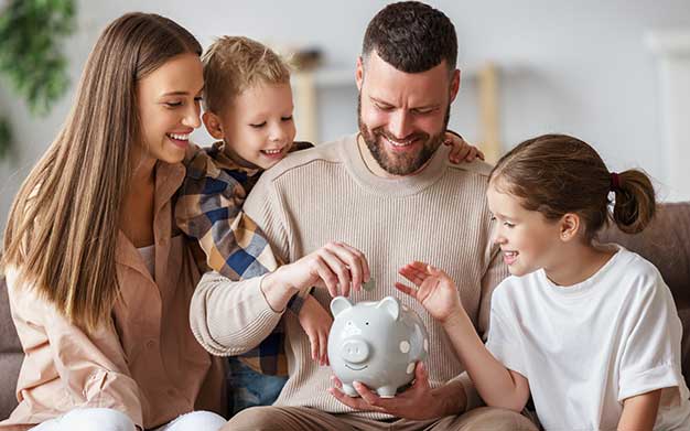 Family saving in piggy bank