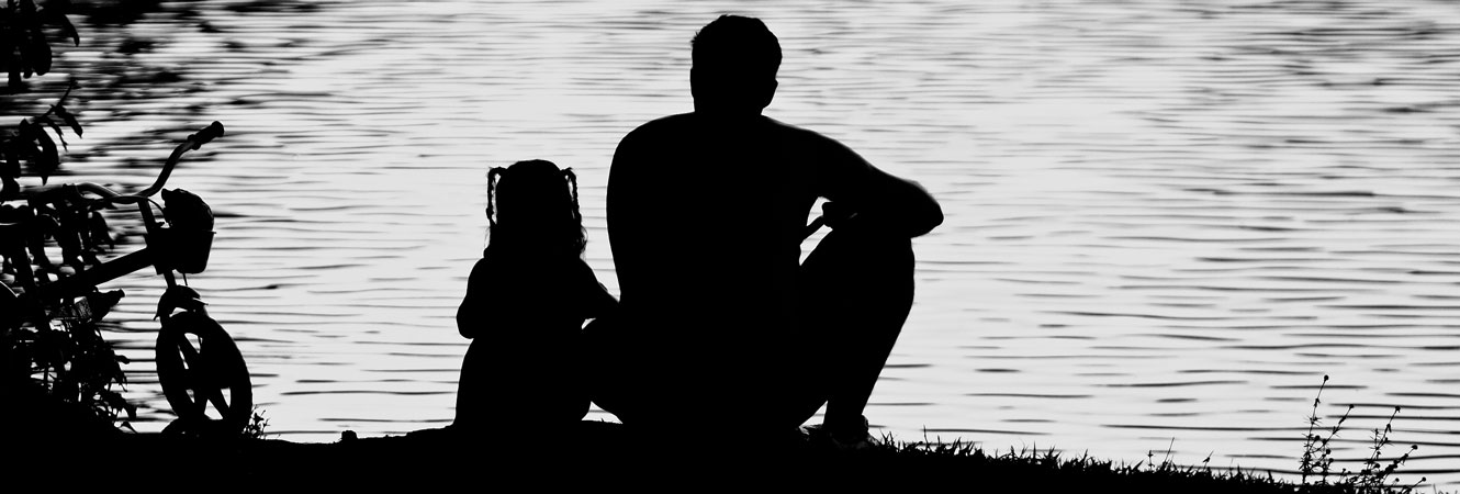 Father and daughter at lake