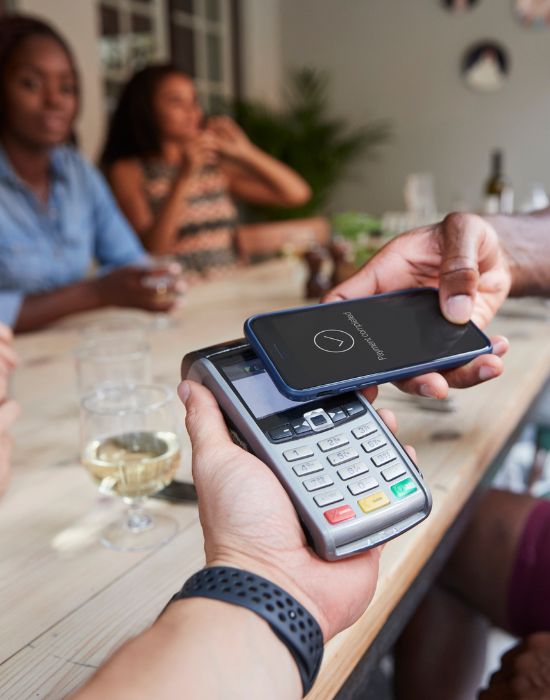image displaying using digital wallet on a phone at a resturant