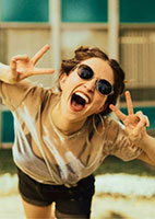 Girl celebrating with peace signs
