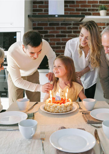 Girl celebrating her birthday with her family