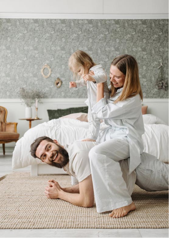A young family playing in their home
