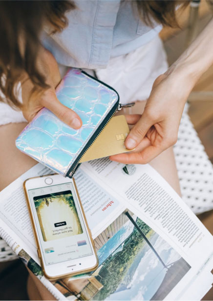Lady using a credit card on her smartphone